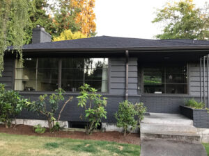 Fiberglass windows on a grey and black home