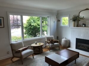 Bay window replacement installation framing landscape view in Magnolia living room