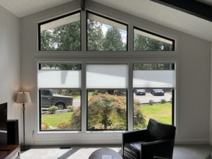 Professional multi-pane window installation with black frames in Bonney Lake residential home